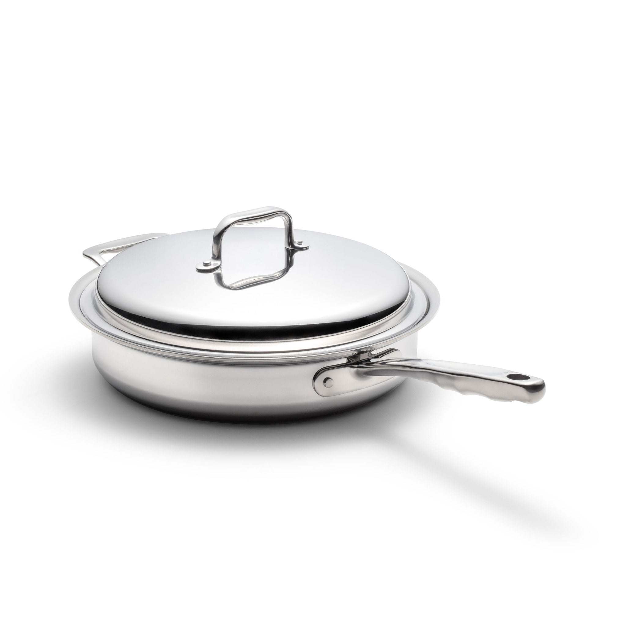 Stainless steel sauté pan with lid on a white background