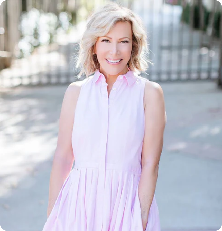 Kym Douglas smiling in a pink dress, influencer for 360cookwares