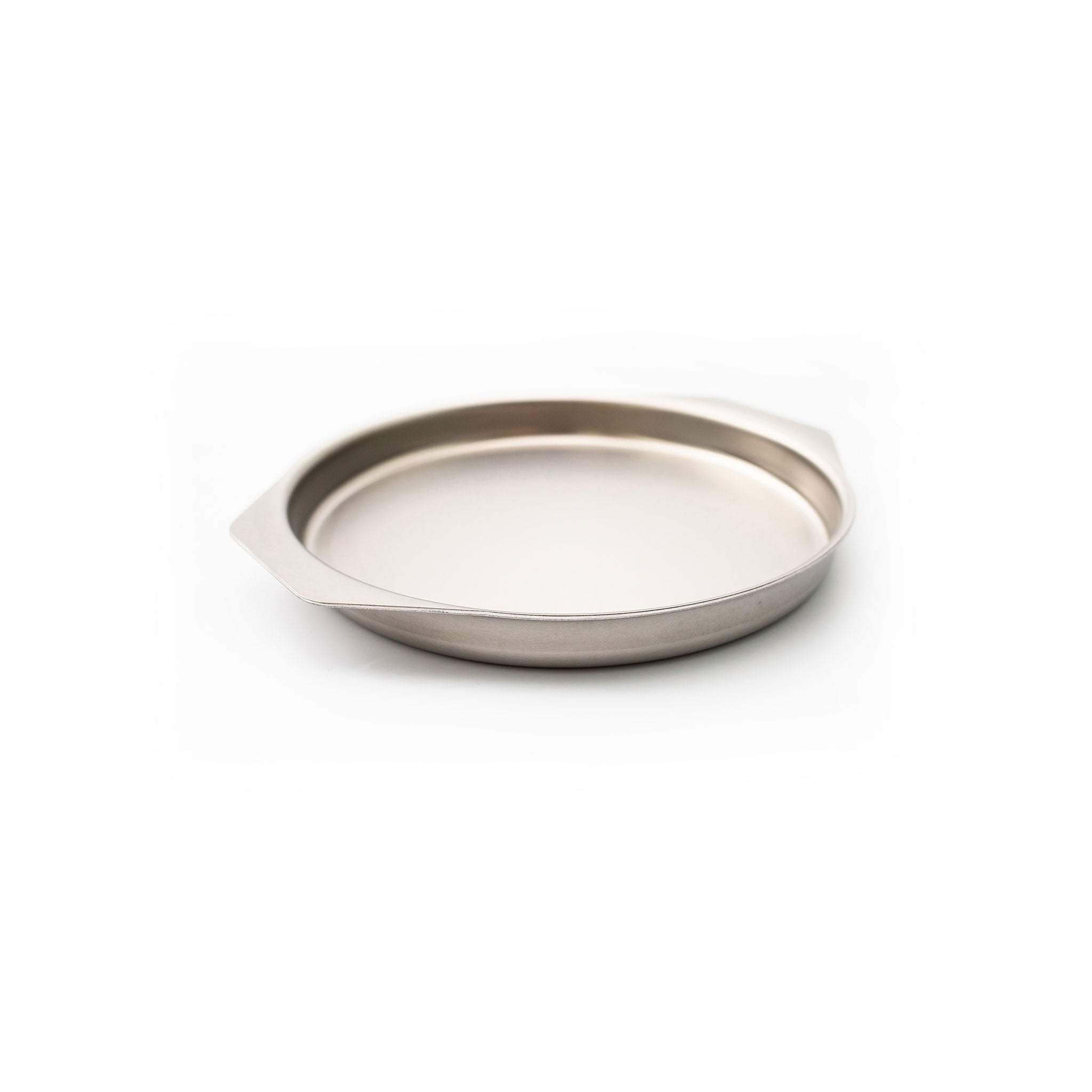 Shallow round stainless-steel baking pan with two small flat handles and brushed finish
