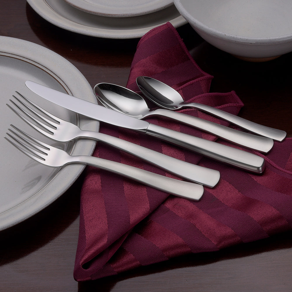 Satin America 45 Piece Set with forks, knives, and spoons on a table setting