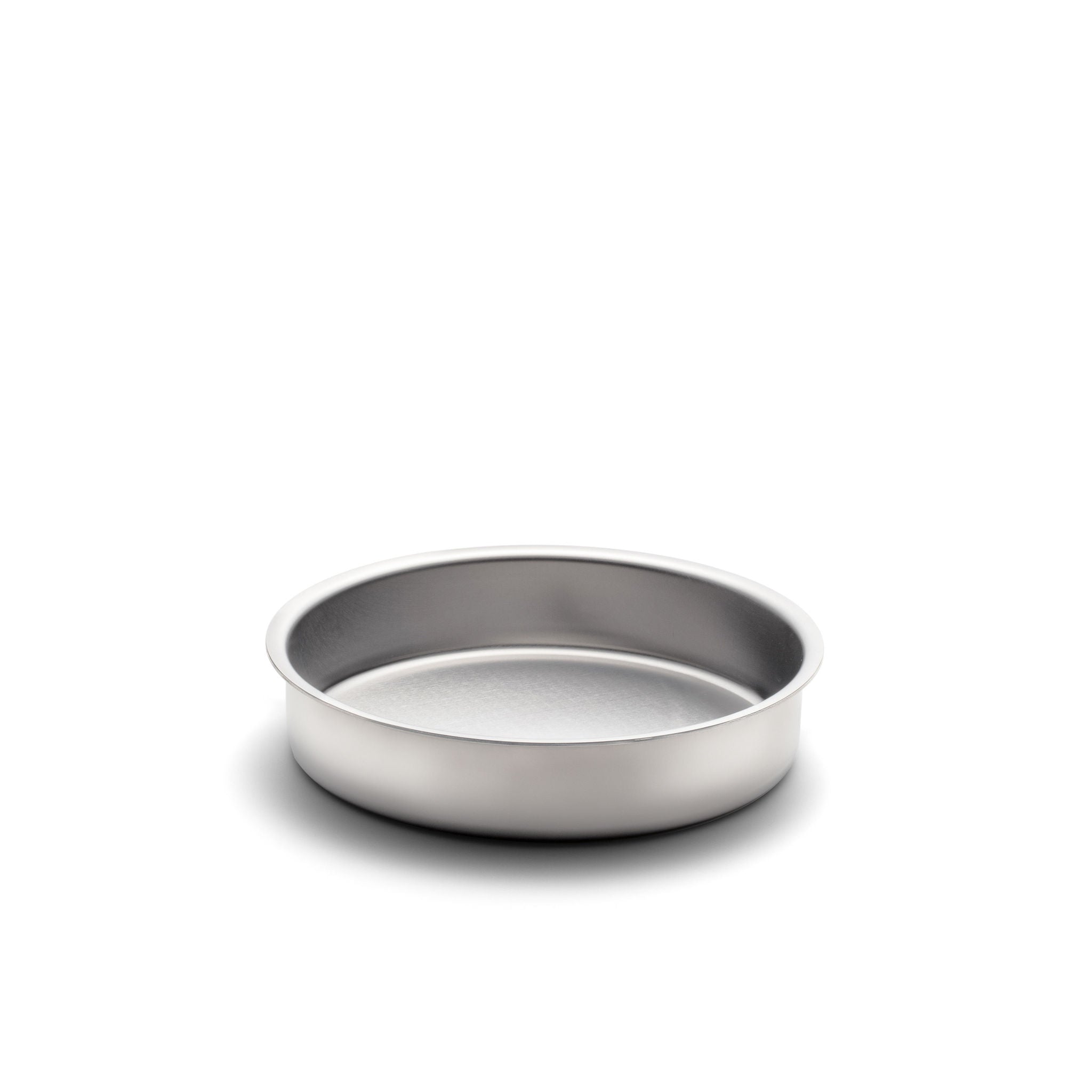 Round stainless-steel cake pan with low sides and rolled rim
