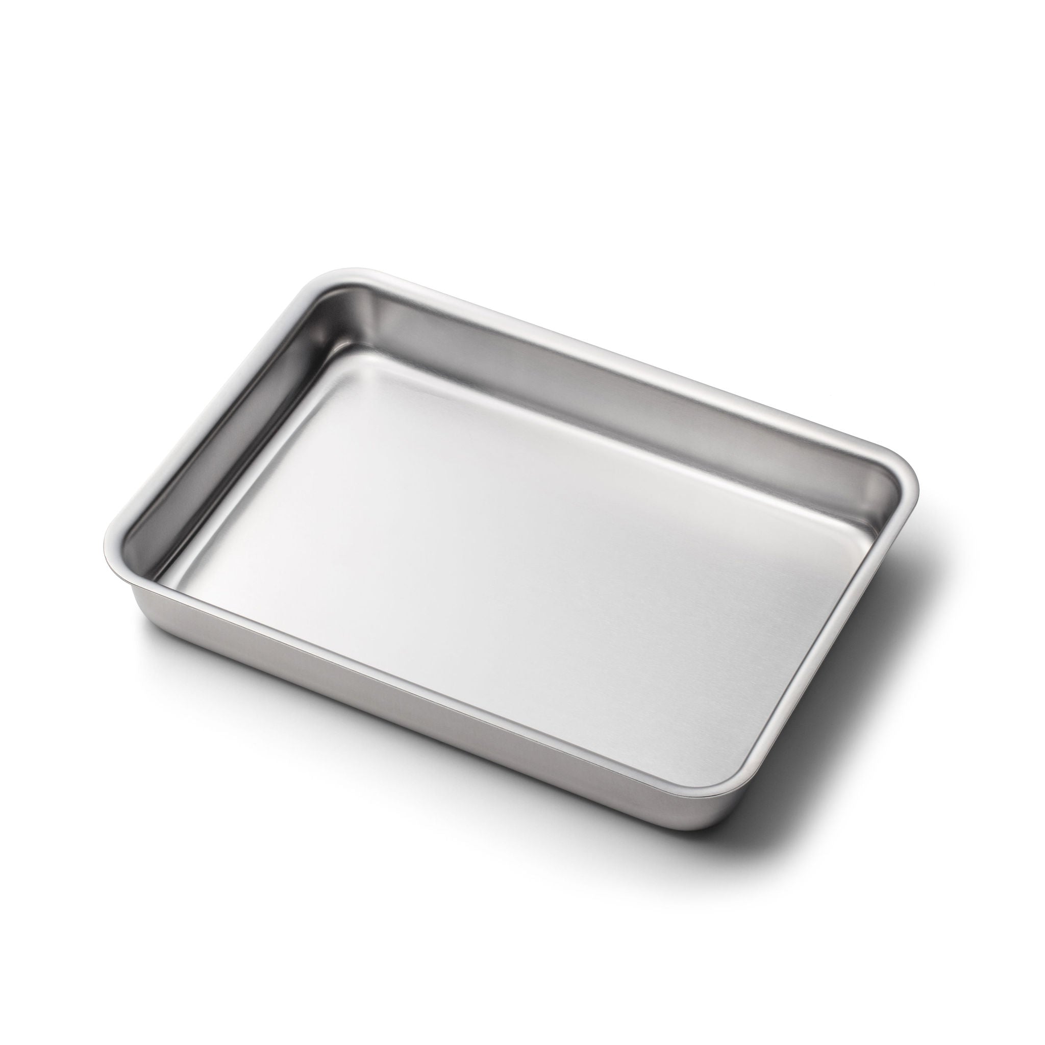 Rectangular stainless-steel baking pan with rounded corners on white background