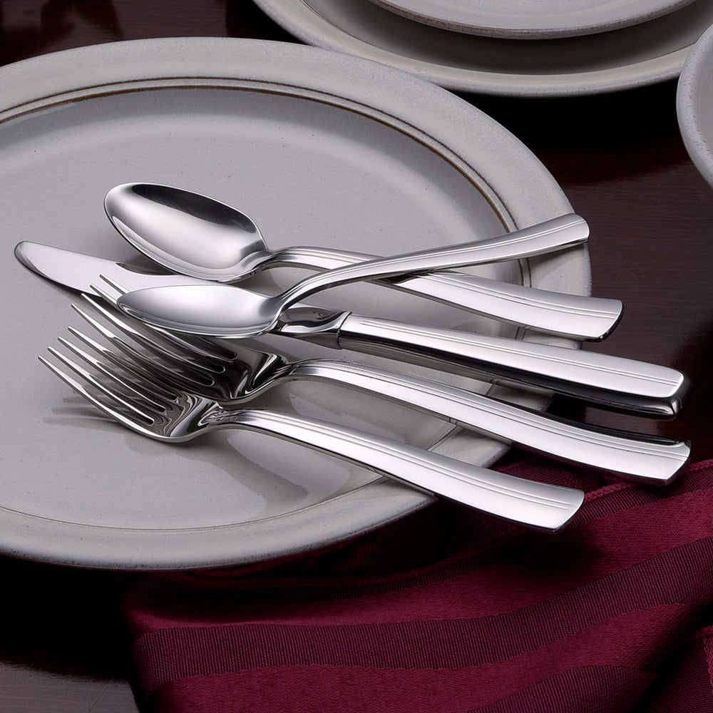 Cedarcrest 45 Piece Set cutlery on a plate with a maroon napkin