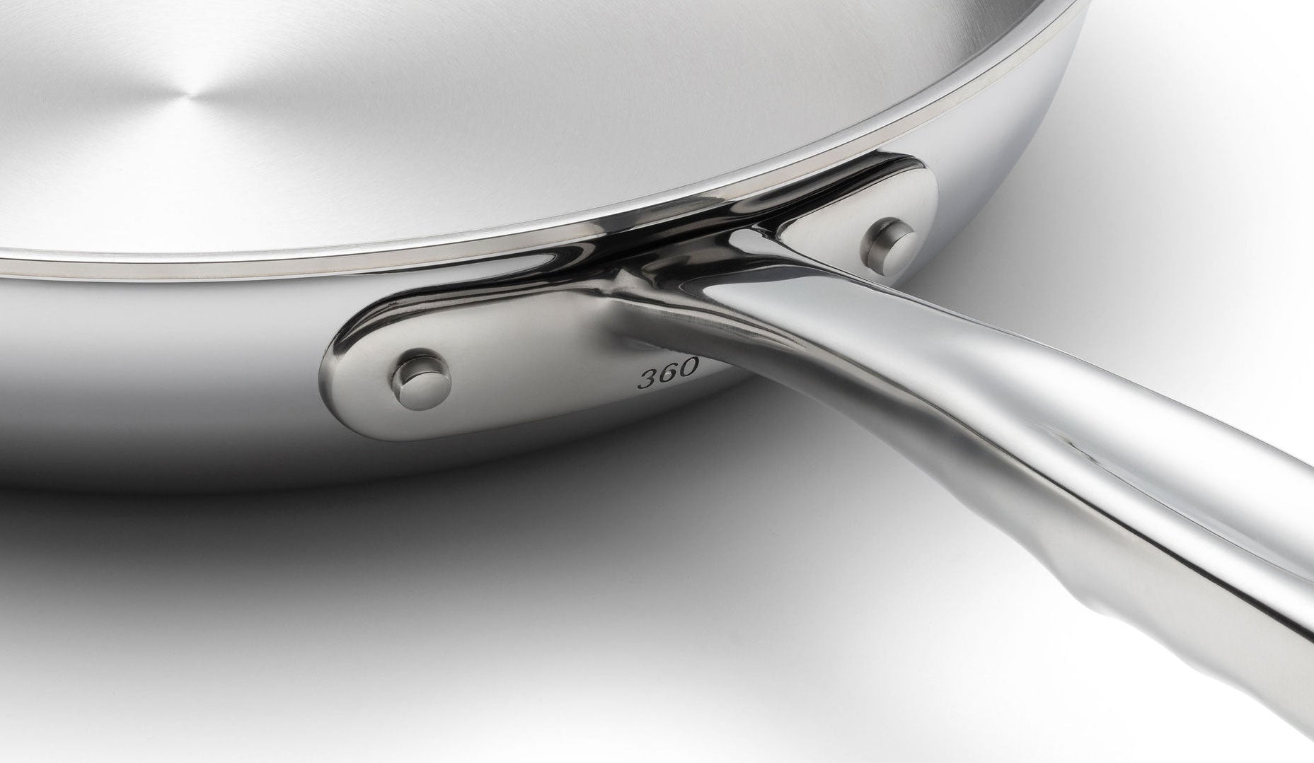 Close-up of a stainless steel frying pan from the 15-Piece Cookware Set, showing the handle and '360' engraving.