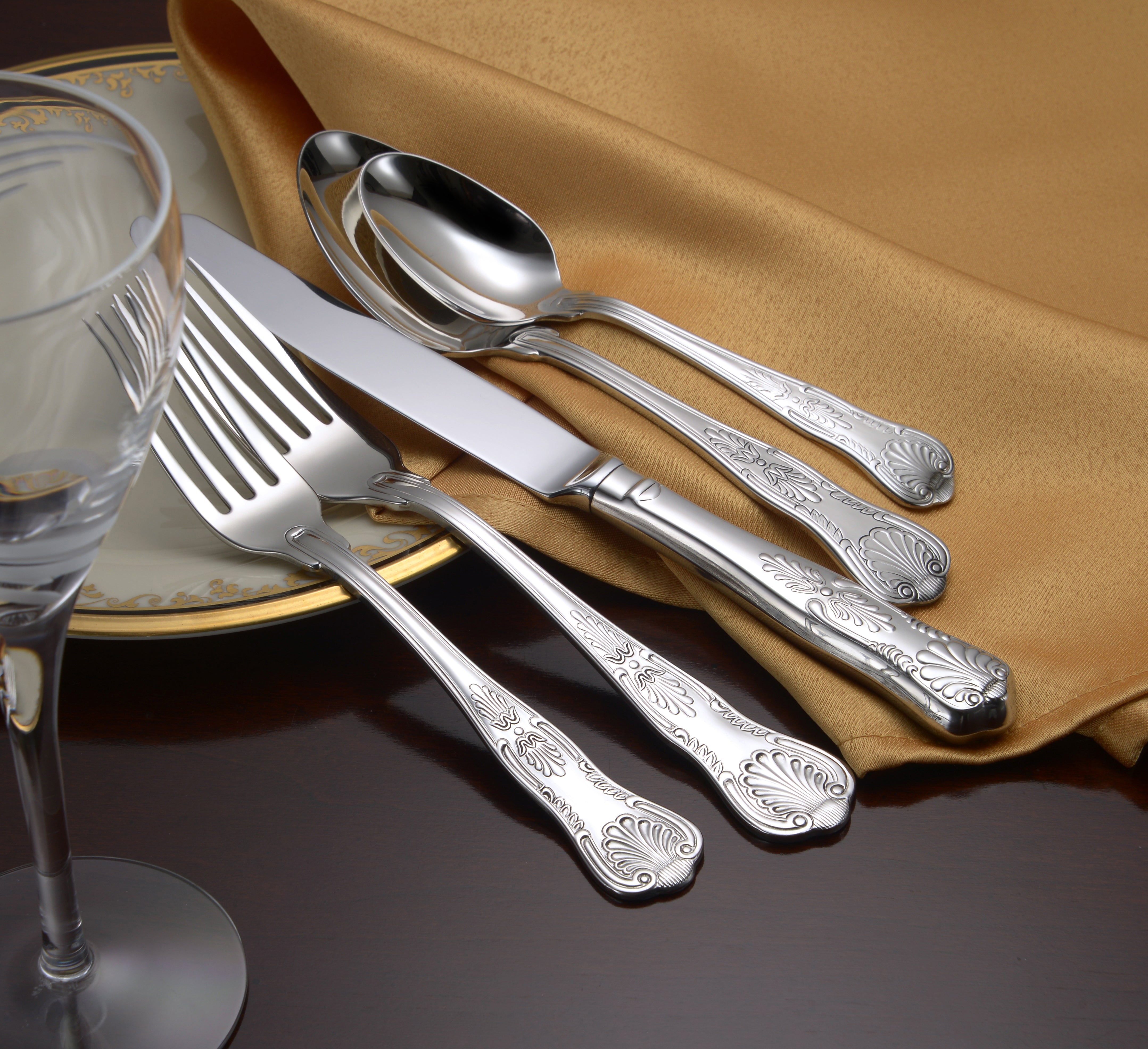 Sheffield 65 Piece Set featuring intricate mirror-polished flatware on a table setting
