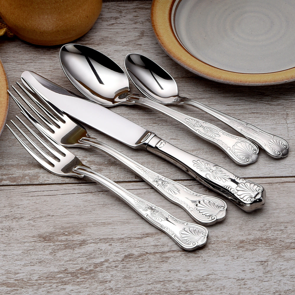 Sheffield 65 Piece Set featuring intricately designed silver flatware on a wooden table