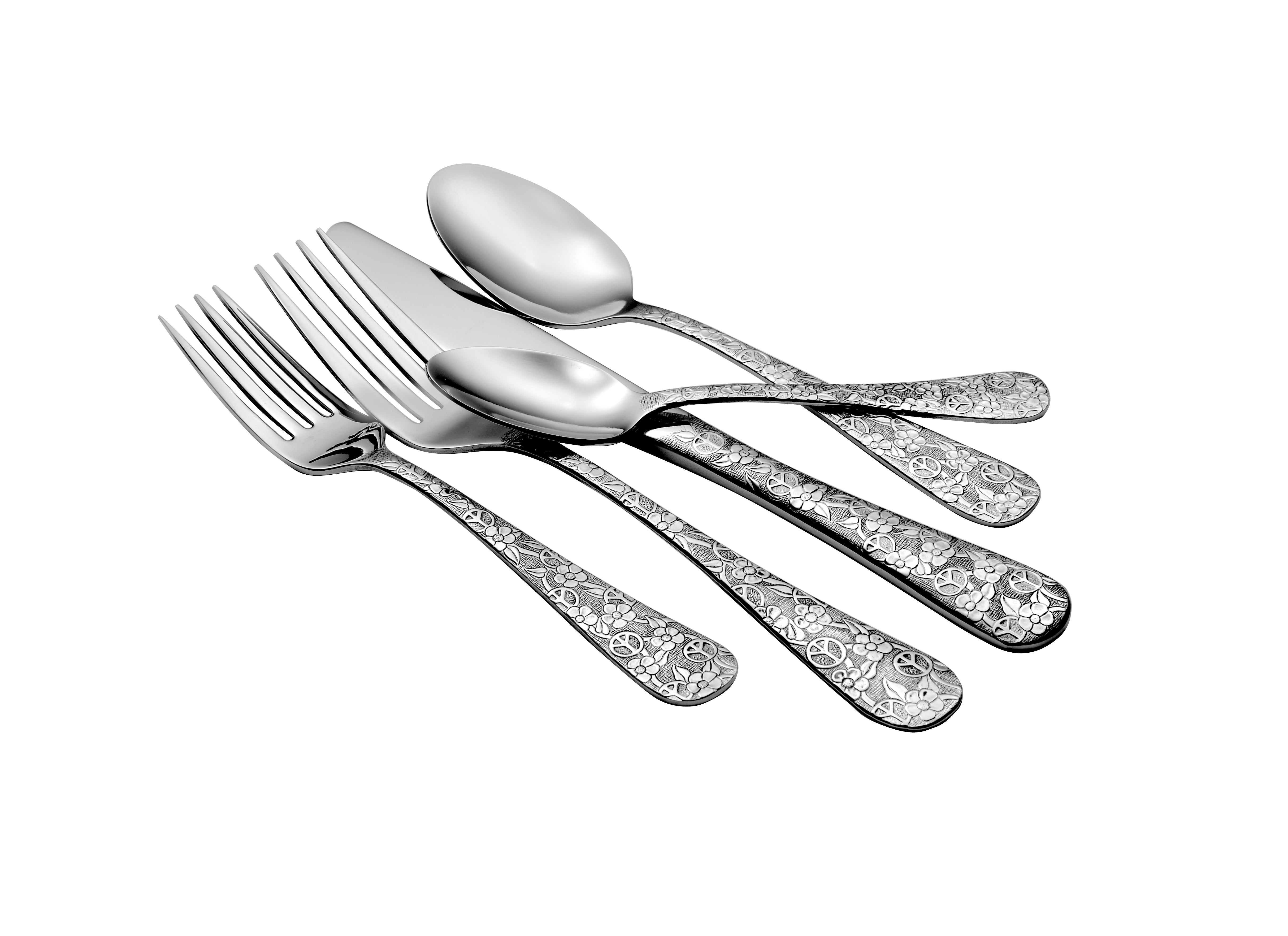 Four pieces of Woodstock flatware including forks and spoons with floral designs.